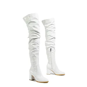 Stylish white patent leather over-the-knee boots featuring a block heel and round toe.