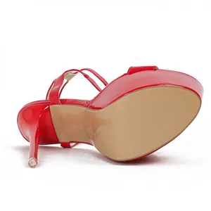 Detailed view of the 16cm stiletto heel and thick platform of red patent sandals