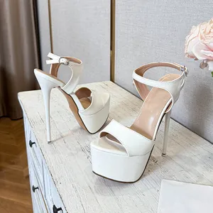 White patent leather platform super high heel sandals with ankle strap for women.