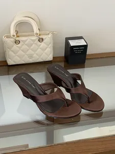 Detail view of brown satin wedge thong sandals with elegant French style