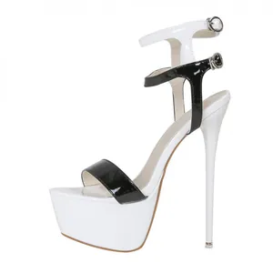 Side view detail of black and white patent leather platform stiletto sandals