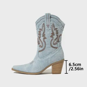 Close-up detail of blue denim western boots showing 6.5cm (2.56in) chunky block heel height