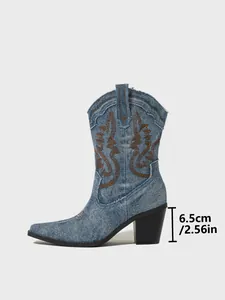 Detailed side view of embroidered denim Western boots with 6.5cm heel measurement