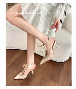 Elegant champagne lace mesh pointed toe stiletto heels with a decorative ankle bow