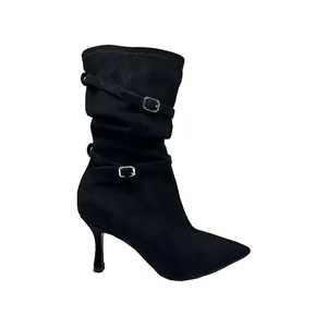 Black pointed-toe stiletto slouch boots featuring decorative buckle straps and soft shaft
