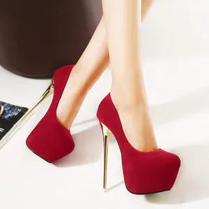 Elegant red suede platform pumps with high gold-tone stiletto heels for nightclubs.