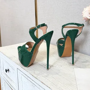 Side view detail of emerald green patent leather platform sandals with stiletto heel