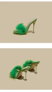 Detail view of stylish green feather high heel sandals with transparent stilettos