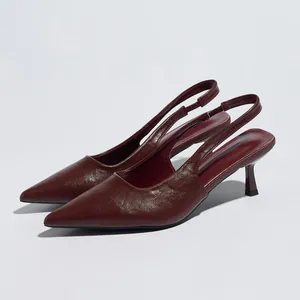 Elegant burgundy pointed-toe slingback kitten heels featuring a glossy leather texture.