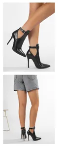 Nahaufnahme eleganter schwarzer Stiletto-Stiefeletten mit spitzer Zehenpartie