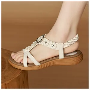 Close-up detail of Bohemian floral sandals with comfortable elastic strap and wedge sole.