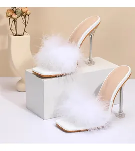 Elegant white high heel sandals with fluffy faux feathers and clear stiletto heels