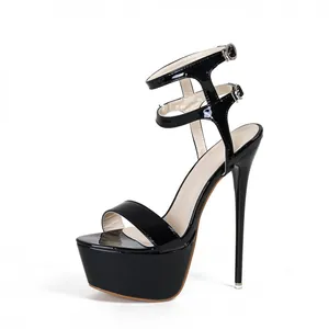 Side detail of elegant 16cm stiletto high heel black patent leather platform sandals.