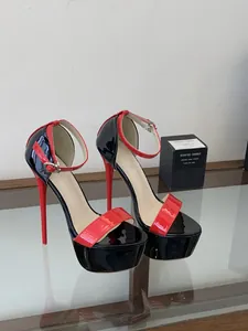 Close-up detail of 16cm platform high heel sandals in red and black patent leather finish.
