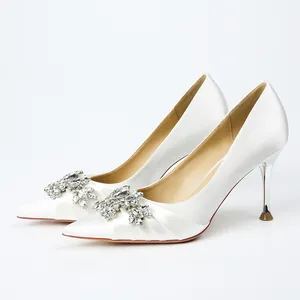 Elegant white satin stiletto high heels featuring a luxury rhinestone crystal buckle detail