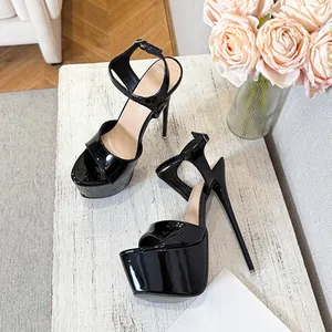 Detailed side view of sexy black patent leather platform sandals with sky-high stiletto heels