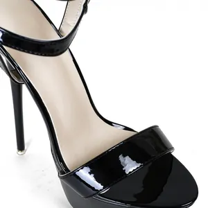 Close-up of sleek black patent leather high heel sandals with thin stiletto heel