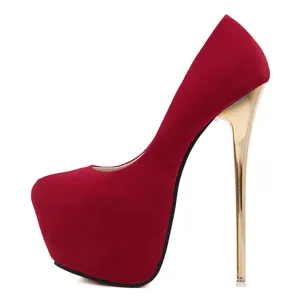 Side view of red suede high heel pumps with gold stiletto and platform