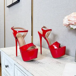 Vibrant red patent leather platform stiletto sandals with elegant ankle strap detail