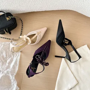 Elegant pointed-toe mesh high heels with bow detail, shown in three stylish colors