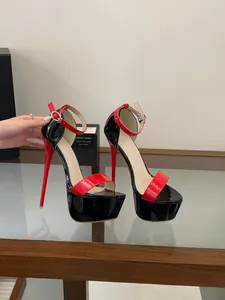 Detailed view of elegant 16cm high heel platform sandals in red and black patent leather