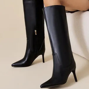 Elegant black pointed toe knee high boots with thin stiletto heels and side zipper