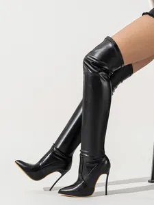Detailed side view of elegant black over-the-knee boots with slim stiletto high heels