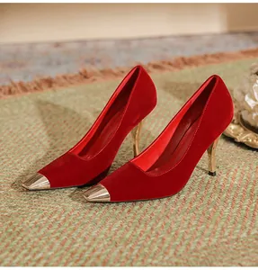 Red velvet high-heeled pumps with elegant gold metal toe caps and slim stiletto heels.