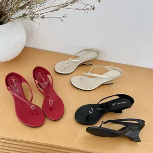 French minimalist wedge flip-flop sandals in red, gold, and black leather for summer fashion