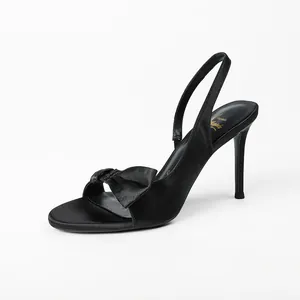 Elegant black satin slingback sandals with bow detail and slim high heels