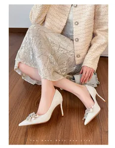 Elegant French sequin wedding pumps with crystal bow detailing and pointed toe