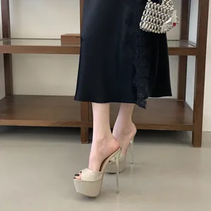 Detail of sexy gold glitter platform stiletto mules with open toe design for women