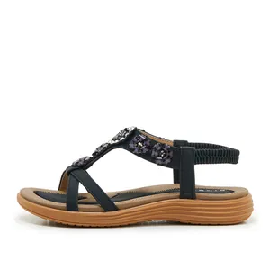 Side view of bohemian black sandals featuring intricate purple flower bead decorations