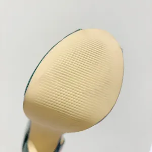 Detailed view of the non-slip textured sole on 16cm platform stiletto high heels.