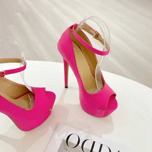 Detailed view of 16cm vibrant pink peep-toe platform sandals with ankle straps