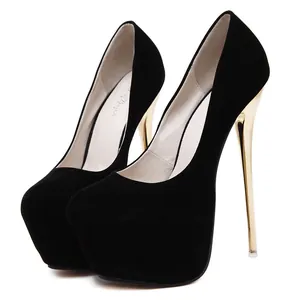 Close-up view of sexy black suede high heel platform pumps with sleek gold stiletto heels