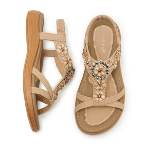 Detailed top view of Bohemian beige sandals with floral jewel accents and elastic heel strap
