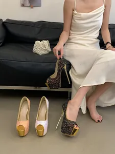 Glittering platform peep-toe pumps with ultra-high stiletto heels in luxury setting