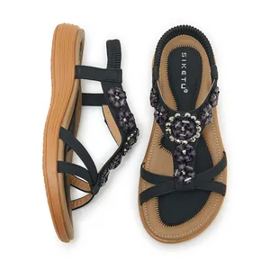 Top and side view of Bohemian style sandals with purple beaded flowers and elastic back