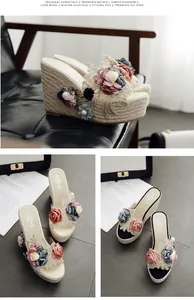 Detailed view of handmade floral beads on platform wedge sandals