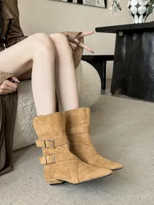 Stylish camel suede ankle boots with pointed toe and double silver buckles on block heels