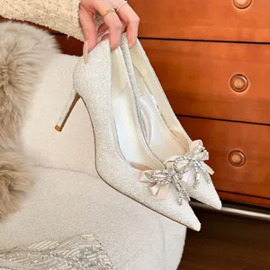 Elegant French style glitter wedding high heels with a stunning crystal bow and pointed toe