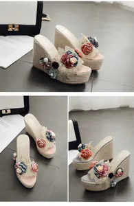 Detail view of handmade floral wedge platform slides with elegant lace and pearl beads