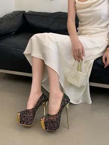 Detailed view of shimmering glitter peep-toe platform stiletto pumps for formal banquets