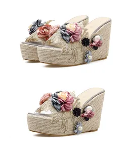 Floral wedge sandals featuring a woven jute platform and elegant bead detailing on straps