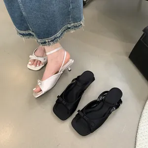 French style bow open toe stiletto sandals featuring ankle straps in black and white