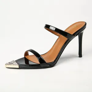 Elegant black patent leather high-heeled sandals featuring rhinestone-embellished metal toe