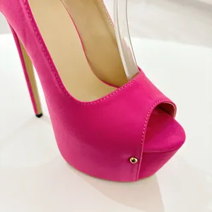 Macro view of pink faux suede 16cm platform peep-toe high heels with gold stud detail