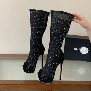 Sexy black mesh knee-high boots featuring rhinestone accents, stiletto heels, and platforms.