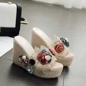 Elegant handmade floral wedge sandals featuring thick platform soles and pearl bead accents